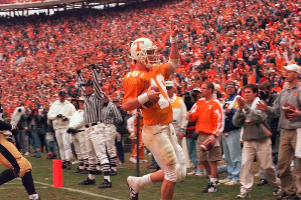 In a Nov. 29, 1997, photograph, Tennessee quarterback Peyton Manning scores the winning touchdown in a 17-10 victory over Vanderbilt during his final game at Neyland Stadium.