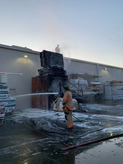 Salem Fire Department crews contain a pallet fire at the Lowe's on Turner Road SE to the rear of the home improvement store building.