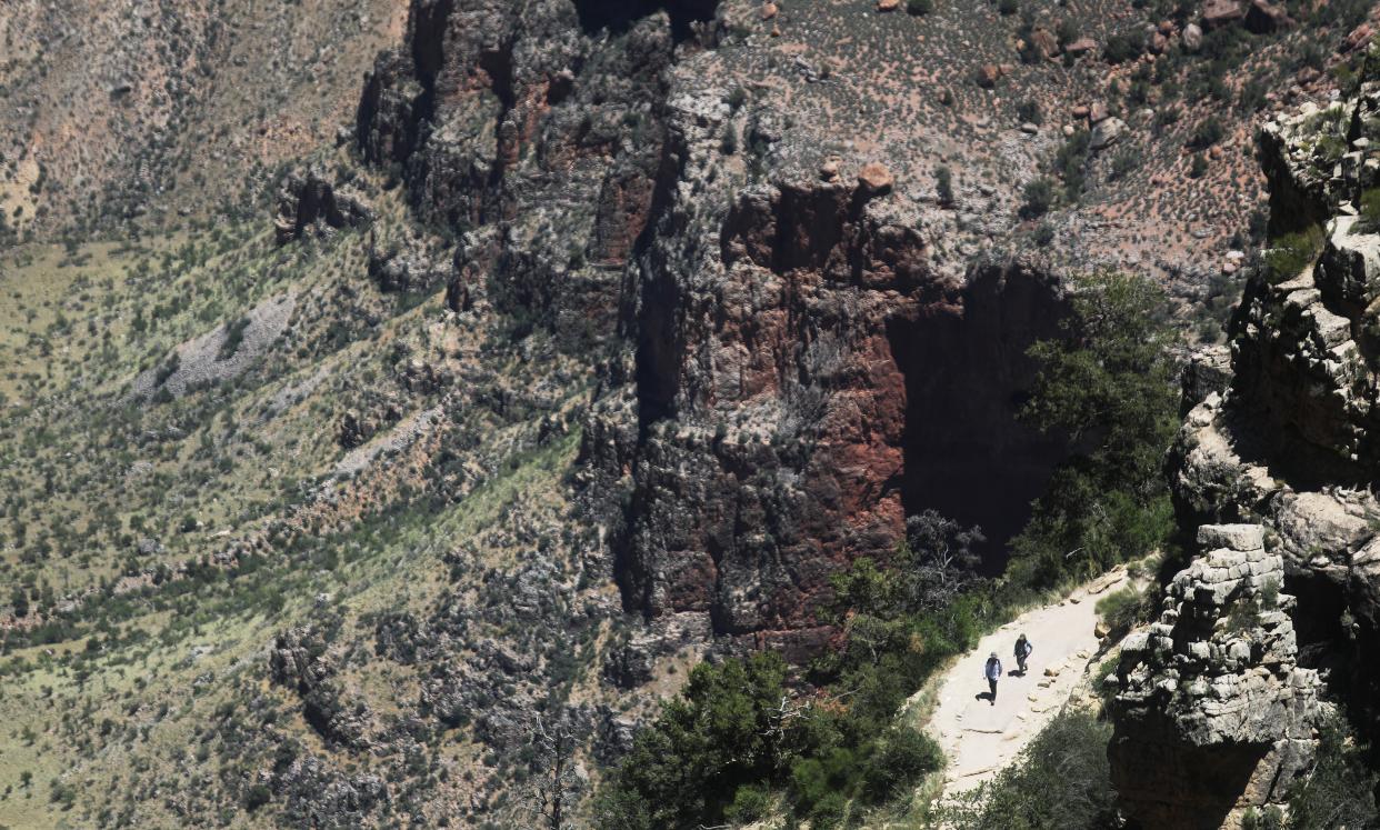 Visitors hike on Memorial Day in the South Rim of Grand Canyon National Park, which has partially reopened on weekends amid the coronavirus (COVID-19) pandemic, on May 25, 2020 in Grand Canyon National Park, Arizona (Getty Images)