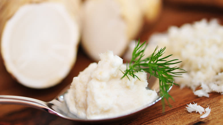 grated horseradish on spoon