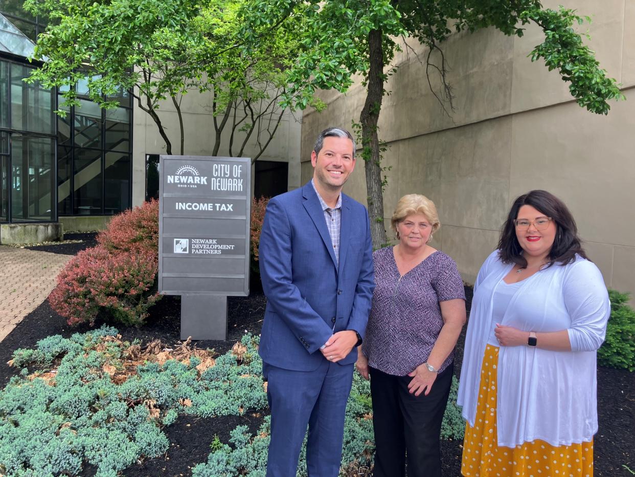 Newark City Treasurer Brad Feightner Jr., Income Tax Administrator Brenda Cooper and Income Tax Office Manager Jillian Frew outside their new workplace on the second floor of the Newark Trade Tower.
