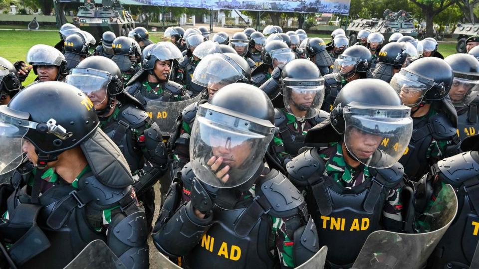 Soldiers from the Iskandar Muda military command take part in a roll call ceremony in Banda Aceh on February 1 ahead of Indonesia's presidential and legislative polls scheduled to be held on February 14. Picture: Chaideer Mahyuddin / AFP