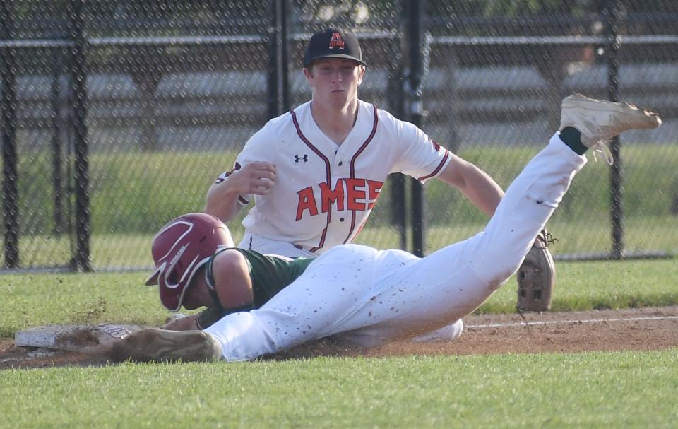 Ames' Mario Napolitano (6 )catches the late thrown ball as Boone's Dylan England (16) slides safely on the third base during the first inning at Ames High baseball field Friday, June 10, 2022, in Ames, Iowa.