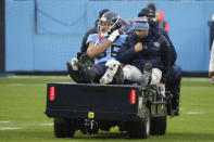 Tennessee Titans tight end MyCole Pruitt is taken off the field after being injured in the first half of an NFL football game against the Miami Dolphins Sunday, Jan. 2, 2022, in Nashville, Tenn. (AP Photo/James Kenney)