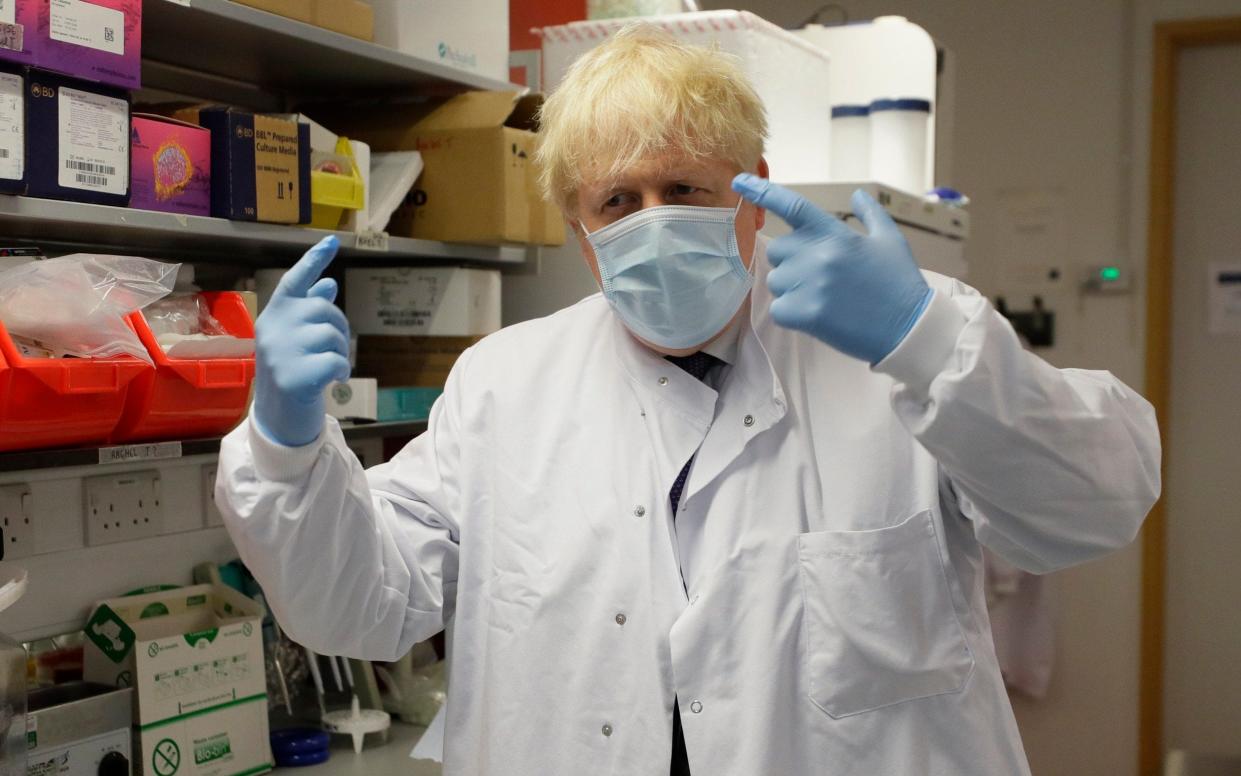 Prime Minister Boris Johnson gestures during a visit to the Jenner Institute in Oxford on Friday - Kirsty Wigglesworth/AP Pool