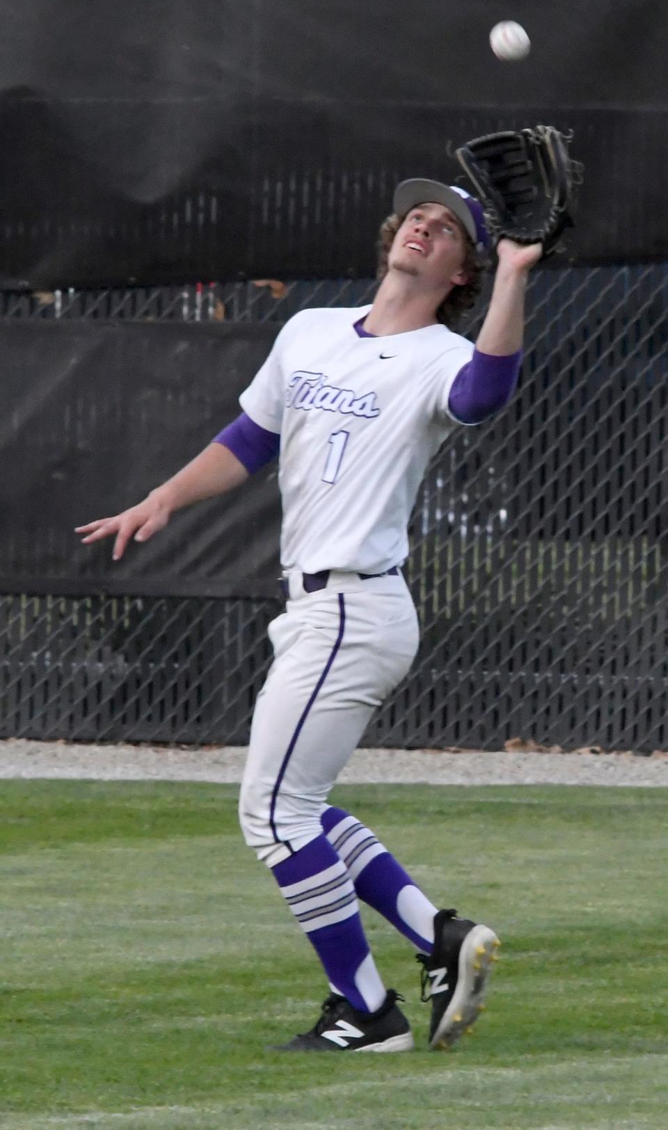 Triway's Brock Tisko flags down a ball in center field.