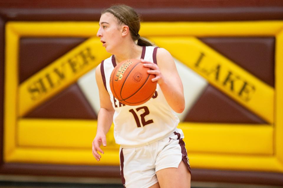 Silver Lake senior McKinley Kruger (12) dribbles the ball back in the second half of the game against Santa Fe Trail Tuesday, Jan. 23, 2024, inside Silver Lake High School.