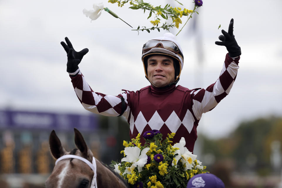 Joel Rosario celebrates after riding Jaywalk to victory in the Breeders' Cup Juvenile Fillies horse race at Churchill Downs, Friday, Nov. 2, 2018, in Louisville, Ky. (AP Photo/Darron Cummings)