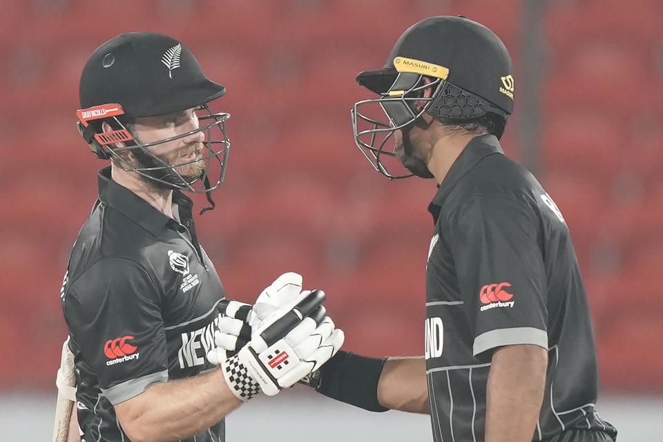 New Zealand's captain Kane Williamson, left, celebrates his fifty runs with Rachin Ravindra during the ICC Cricket World Cup warmup match between New Zealand and Pakistan in Hyderabad, India, Friday, Sept. 29, 2023. (AP Photo/Mahesh Kumar