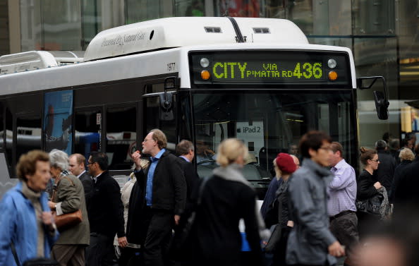 A bus is pictured in Sydney's CBD near pedestrians.