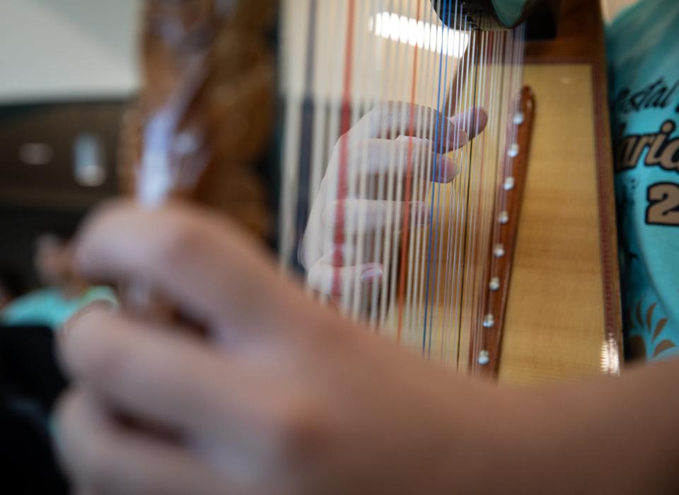 Daniel Flores, 15, plays the harp during mariachi camp rehearsal at Robstown High School, on Thursday, June 29, 2023, in Texas.