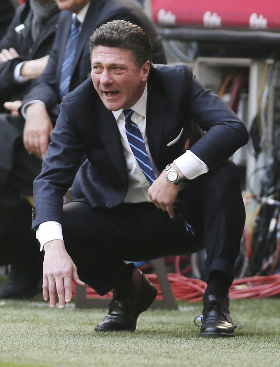 Inter Milan coach Walter Mazzarri looks the match during the Serie A soccer match between Inter Milan and Torino at the San Siro stadium in Milan, Italy, Sunday, March 9, 2014. (AP Photo/Antonio Calanni)