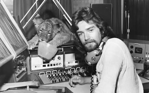 Radio 1 DJ Noel Edmonds in the radio studio recording his BBC breakfast show, with Tiddles the lion cub as special guest, Broadcasting House, London, August 30th 1973 - Credit: Fox Photos/HULTON ARCHIVE