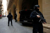 Armed police officers of the Malta Police Special Intervention Unit provide security as three men, accused of the assassination of anti-corruption journalist Daphne Caruana Galizia, arrive for their lawyers’ submissions for bail at the Courts of Justice in Valletta, Malta April 17, 2018. REUTERS/Darrin Zammit Lupi