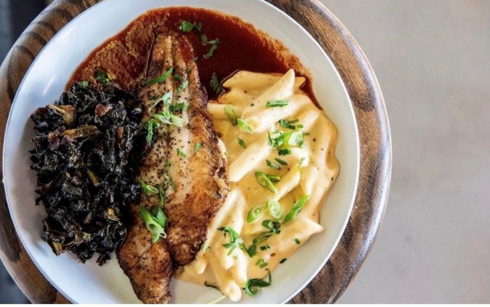 Pan Seared Mississippi Catfish with Mac-n-Cheese, Braised Greens and a Smoked Tomato Broth at The Farmer restaurant in Midtown Memphis.