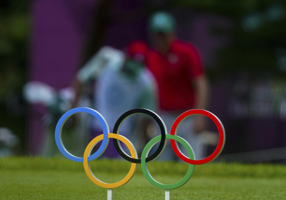 FILE - Carlos Ortiz of Mexico walks behind the Olympics rings symbol on the 11th fairway during the second round of the men's golf event at the 2020 Summer Olympics on Friday, July 30, 2021, at the Kasumigaseki Country Club in Kawagoe, Japan. Mexico has declared its desire to host the Summer Olympics in 2036 or 2040 and says it already has most of the sports infrastructure required. (AP Photo/Matt York, File)