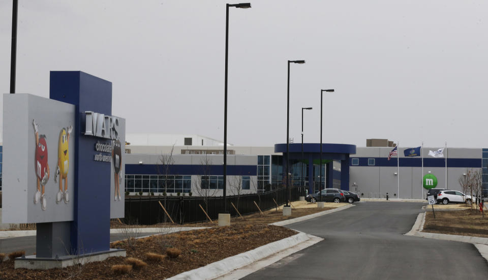 This Wednesday, March 26, 2014 photograph shows the entrance of the new Mars Inc. production facility near Topeka, Kan. It's the company's first new North American production facility in 35 years. (AP Photo/Orlin Wagner)