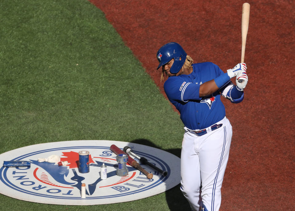 TORONTO, ON - JUNE 08: Vladimir Guerrero Jr. #27 of the Toronto Blue Jays warms up in the on-deck circle as he gets ready to bat in the eighth inning during MLB game action against the Arizona Diamondbacks at Rogers Centre on June 8, 2019 in Toronto, Canada. (Photo by Tom Szczerbowski/Getty Images)