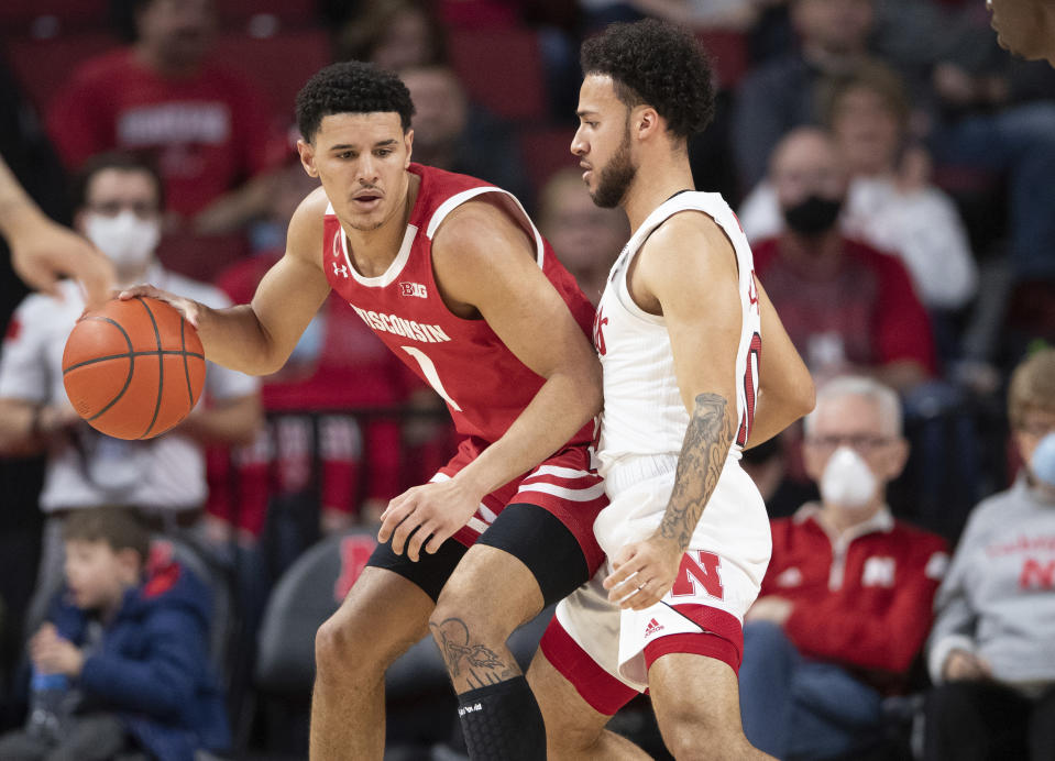 Wisconsin's Jonathan Davis (1) plays against Nebraska's Kobe Webster, right, during the first half of an NCAA college basketball game Thursday, Jan. 27, 2022, in Lincoln, Neb. (AP Photo/Rebecca S. Gratz)