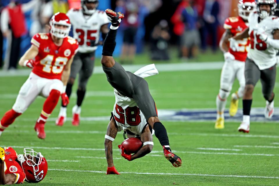 Buccaneers receiver Jaydon Mickens (85) gets upended afater a second-quarter catch.