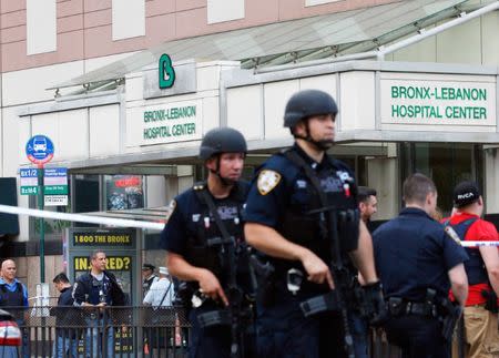 Police officers patrol the scene after an incident in which a gunman fired shots inside the Bronx-Lebanon Hospital in New York City, U.S. June 30, 2017. REUTERS/Brendan Mcdermid