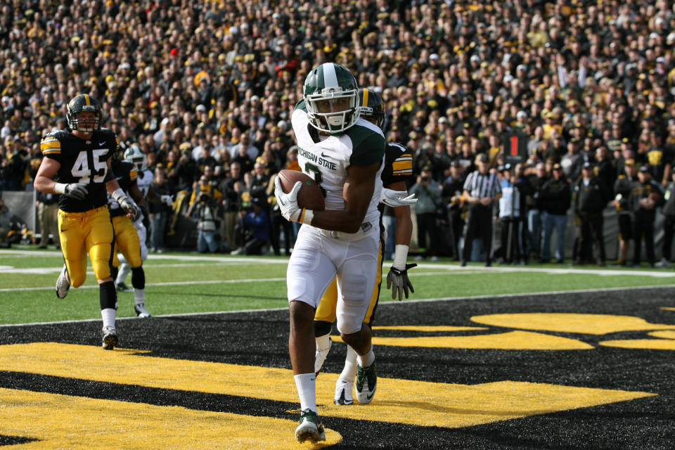 IOWA CITY, IA - NOVEMBER 12: B. J. Cunningham #3 of the Michigan State Spartans scores a touchdown against the Iowa Hawkeyes at Kinnick Stadium November 12, 2011 in Iowa City, Iowa. (Photo by Reese Strickland/Getty Images)