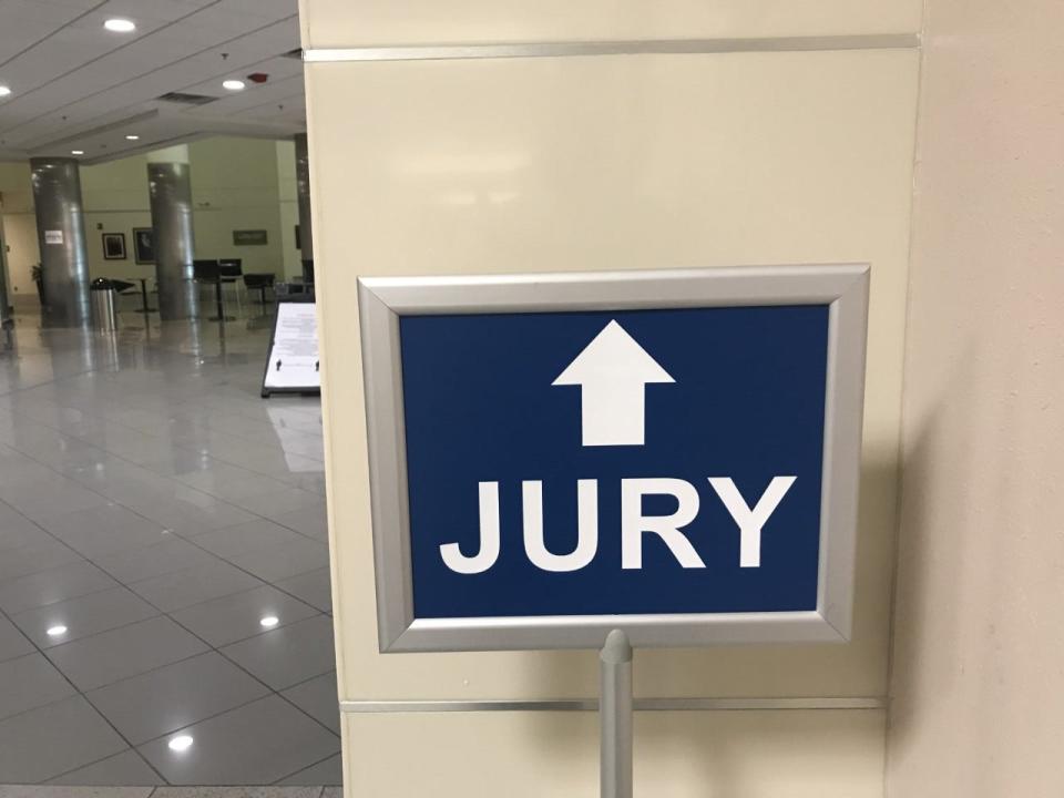 A sign directs those reporting for jury service at the Marion County Judicial Center in Ocala.
