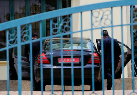 North Korean embassy officials prepare to leave in a car at their embassy compound in Kuala Lumpur, Malaysia March 7, 2017. REUTERS/Lai Seng Sin