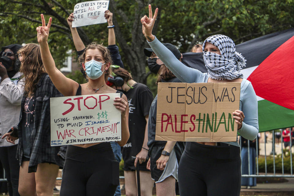 Pro-Palestinian demonstrators hold signs protesting the Israel-Hamas war Thursday, May 2, 2024, at the University of Mississippi. (Maria Ramirez / The Daily Mississippian via AP)