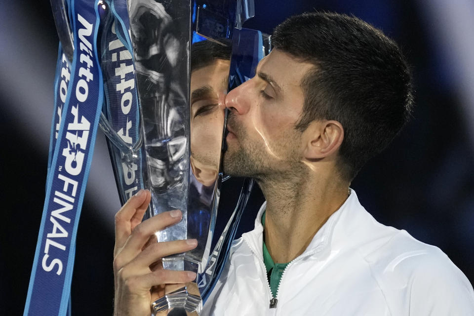 Serbia's Novak Djokovic poses with his trophy after defeating Norway's Casper Ruud 7-5, 6-3, in the singles final tennis match to win the ATP World Tour Finals at the Pala Alpitour, in Turin, Italy, Sunday, Nov. 20, 2022. (AP Photo/Antonio Calanni)