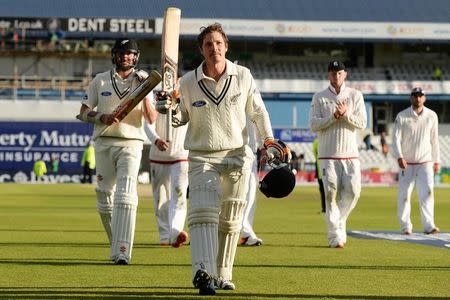 New Zealand's BJ Watling leaves the field at the end of the days play after scoring a century. Action Images via Reuters / Philip Brown