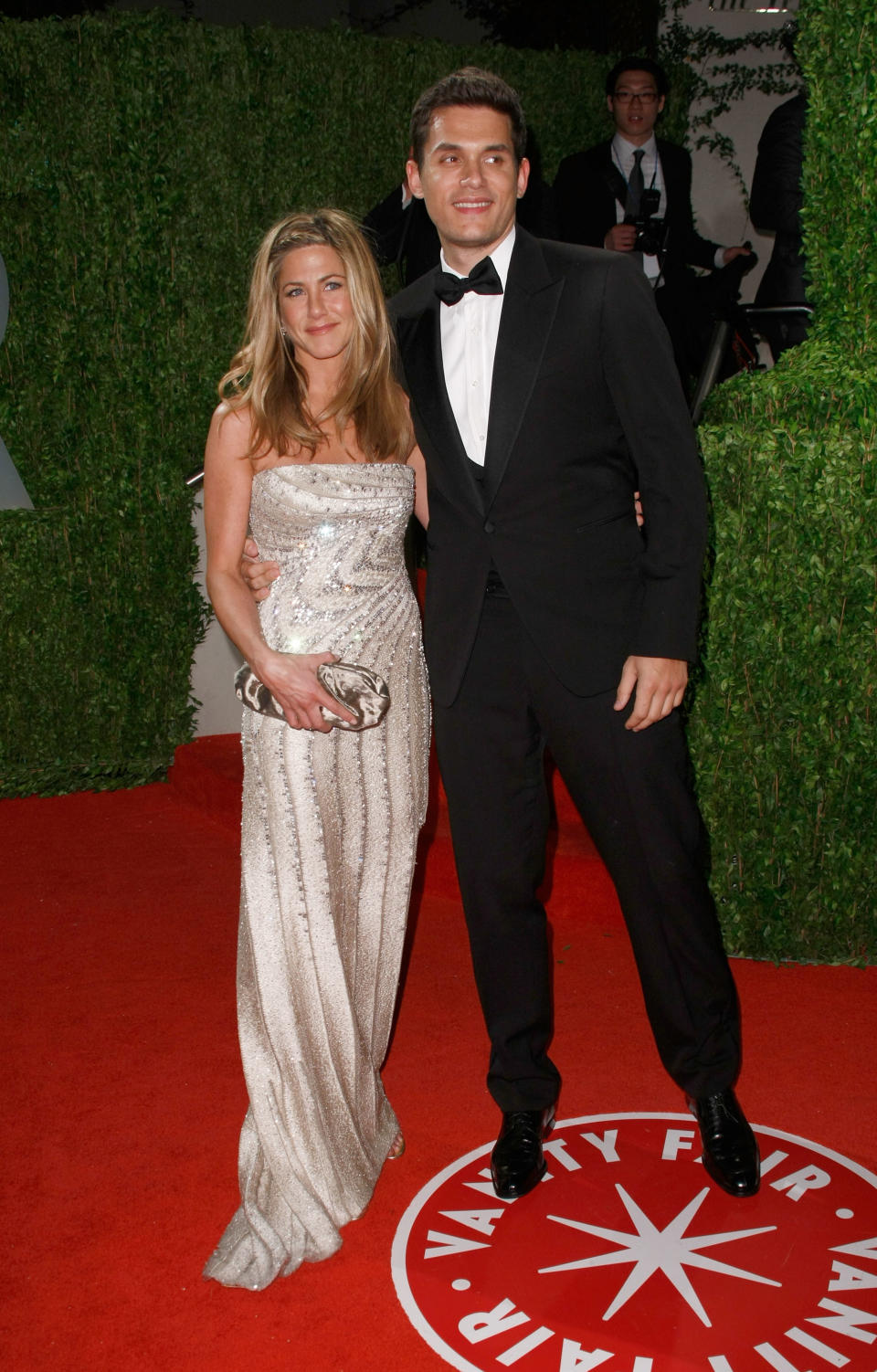 Aniston opted for a silver Valentino gown for her first red-carpet appearance with then-boyfriend John Mayer at the 2009 Vanity Fair Oscar Party. (Image via Getty Images)