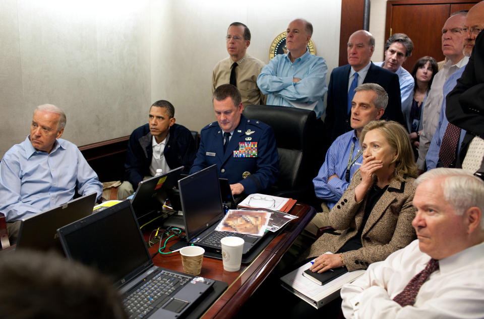 President Barack Obama and Vice President Joe Biden, along with with members of the national security team, receive an update on the mission against Osama bin Laden in the Situation Room of the White House in Washington, D.C., May 1, 2011. Seated, from left, are: Brigadier General Marshall B. 