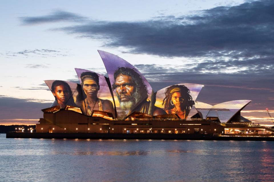 The sails of the Sydney Opera House are illuminated by a projection of indigenous artwork by artist Brett Leavy (Getty Images)