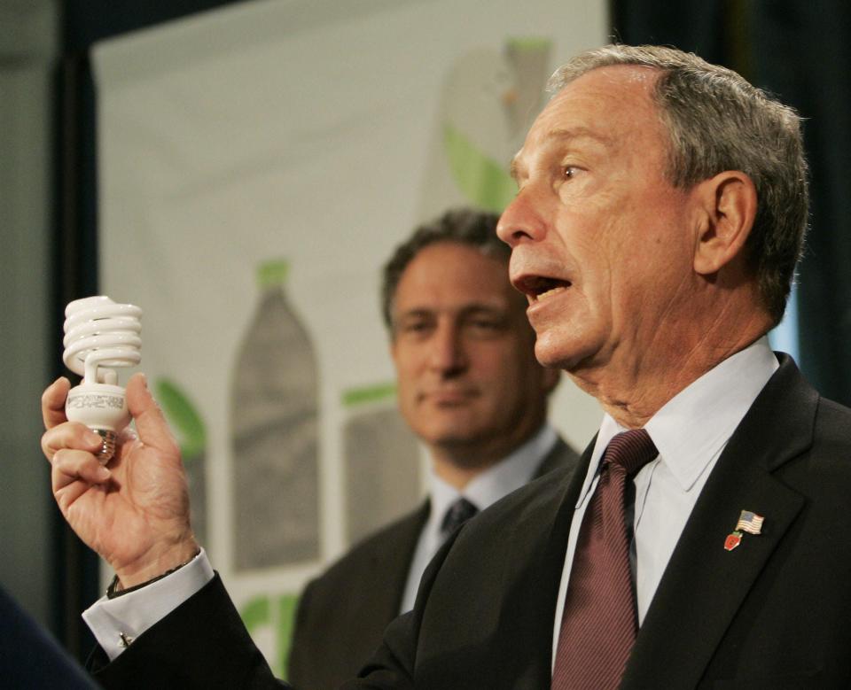 New York City mayor Michael Bloomberg holds a low-energy household flourecent light bulb.
