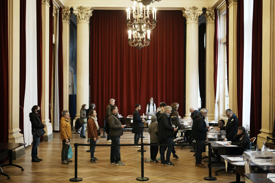 People queue to vote in a citywide mini-referendum: "For or against self-service scooters in Paris?" at the city hall of the 10th district of Paris, Sunday, April 2, 2023. The wheels may be about to come off Paris' experiment with for-hire electric scooters. That's if Parisians vote on Sunday to do away with the 15,000 opinion-dividing micro-vehicles. (AP Photo/Thibault Camus)