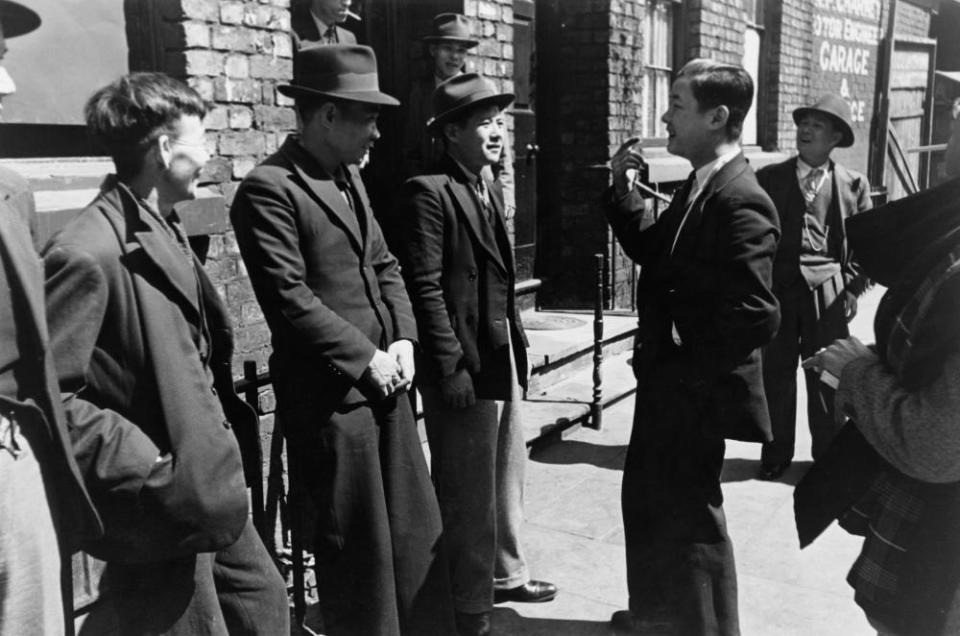 A group of Chinese seamen outside a Chinese hostel in Liverpool, May 1942.