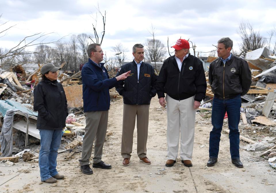 President Donald Trump chats with Tennessee first lady Maria Lee, Putnam County Mayor Randy Porter, Cookeville Mayor Ricky Shelton and Tennessee Gov. Bill Lee Friday, March 6, 2020 in Putnam County, Tenn. after tornadoes ripped through Middle Tennessee earlier in the week killing 25 people.