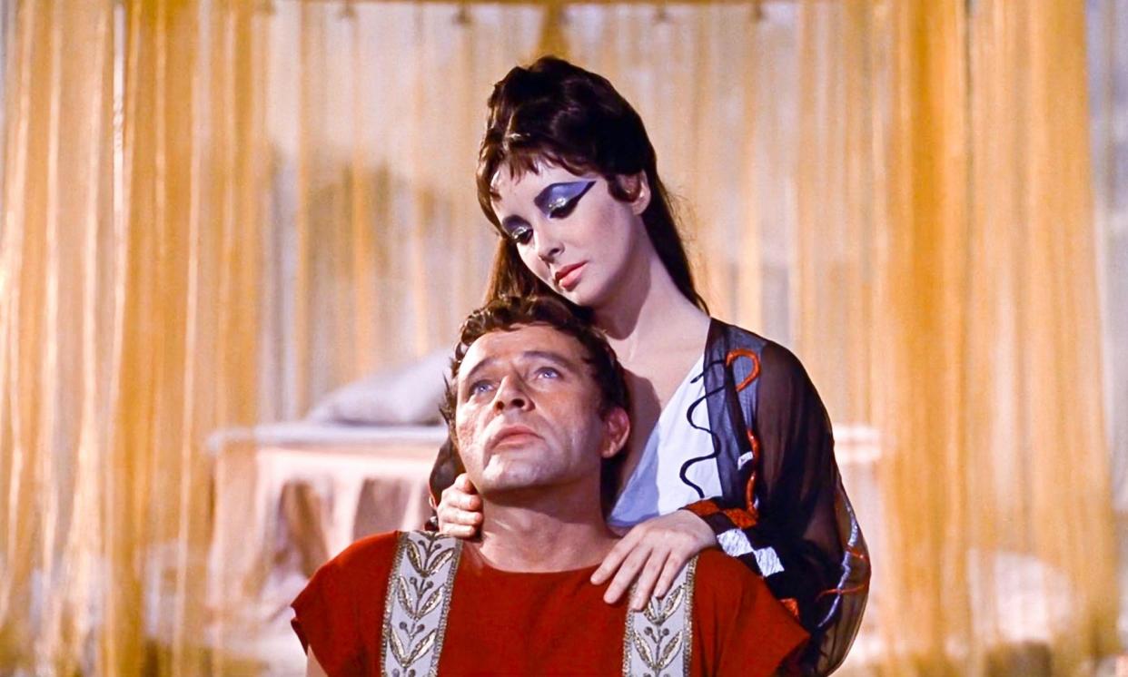 <span>Demonised as an evil seductress, says one reader … Elizabeth Taylor as Cleopatra, with Richard Burton in the 1963 film.</span><span>Photograph: Landmark Media/Alamy</span>