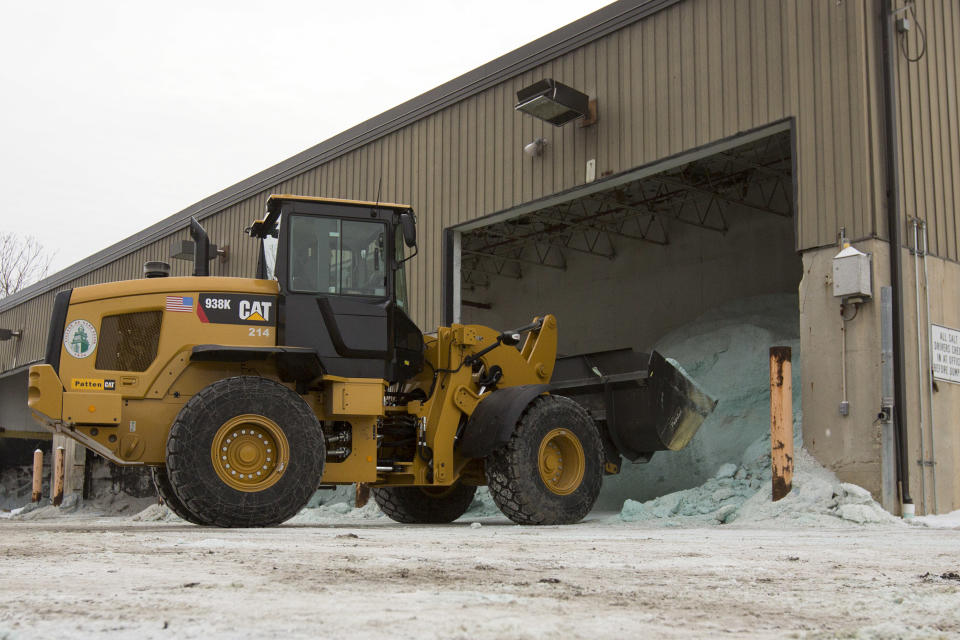 Road salt is unloaded from storage at the public works facility in Glen Ellyn, Ill., on Tuesday, Feb. 4, 2014. The Midwest's recent severe winter weather has caused communities to expend large amounts of their road salt supplies. (AP Photo/Andrew A. Nelles)