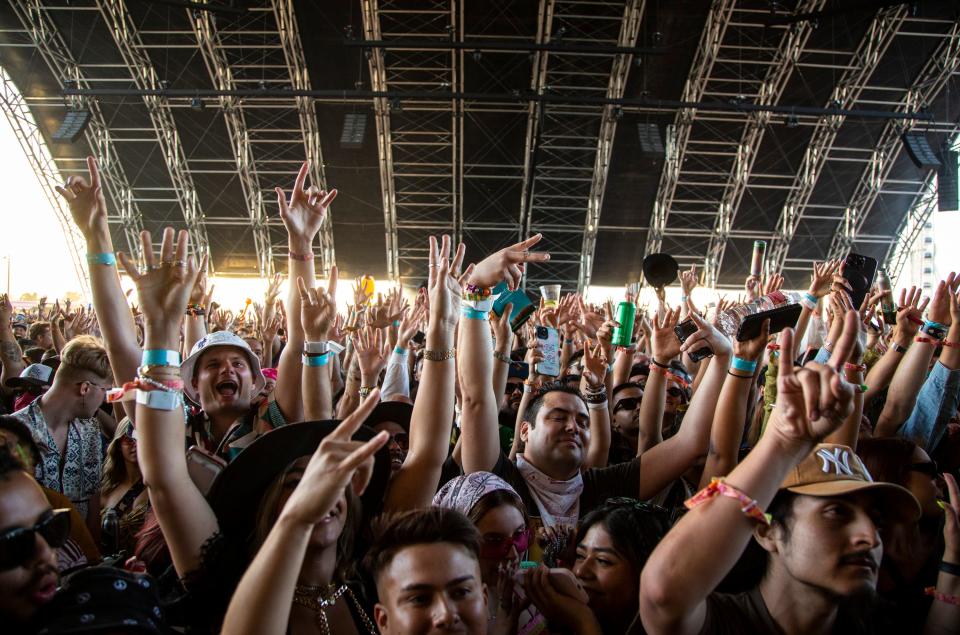 Fans cheer for Blink-182 as they come out for their set in the Sahara tent during the Coachella Valley Music and Arts Festival at the Empire Polo Club in Indio, Calif., Friday, April 14, 2023. 
