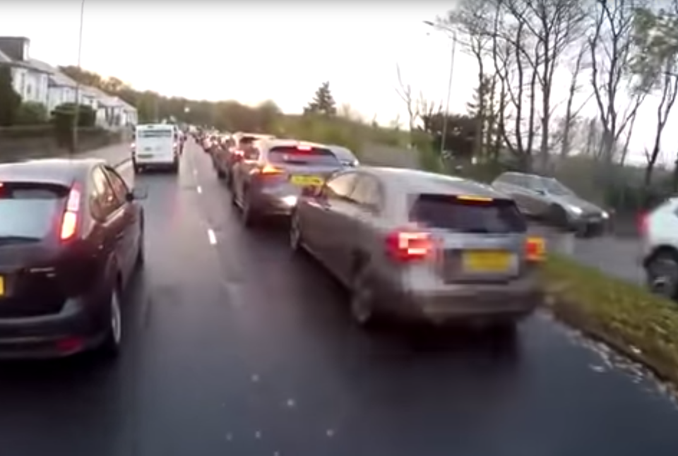 <p>Footage from cyclist’s helmet camera captures the two road users arguing before the motorist rear-ends another car</p>