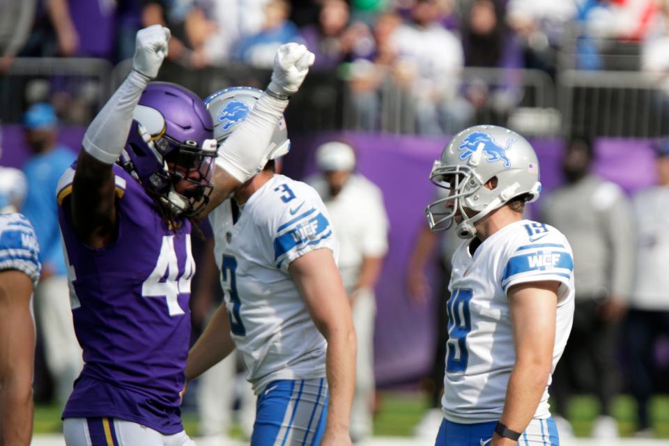 Lions place kicker Austin Seibert, right, reacts in front of Vikings safety Josh Metellus (44) after missing a field goal during the second half  Sunday, Sept. 25, 2022, in Minneapolis. The Vikings won, 28-24.