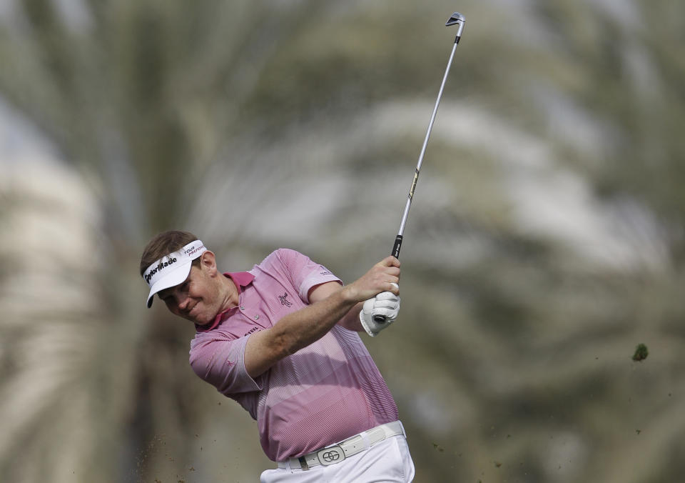 Stephen Gallacher from Scotland plays a ball on the 14th hole during the third round of the Dubai Desert Classic golf tournament in Dubai, United Arab Emirates, Saturday Feb.1, 2014. (AP Photo/Kamran Jebreili)