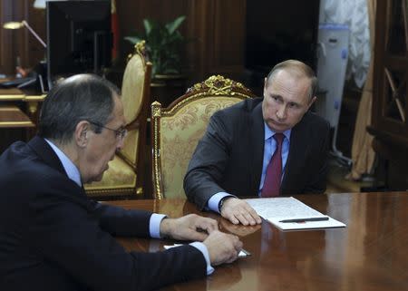 Russian President Vladimir Putin meets Foreign Minister Sergei Lavrov at the Kremlin in Moscow, Russia, March 14, 2016. REUTERS/Mikhail Klimentyev/Sputnik/Kremlin