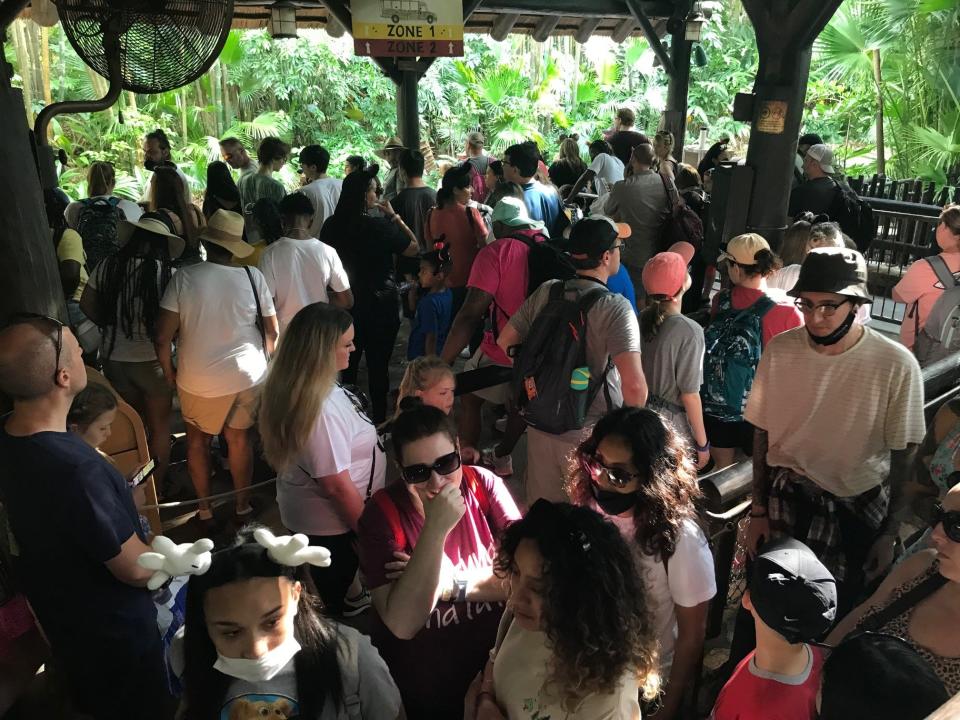 Guests queue up in a long line for the Kilimanjaro Safari attraction at Walt Disney World's Animal Kingdom on April 15, 2022.