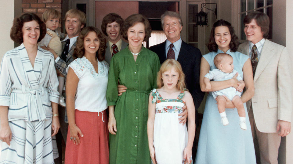 A portrait of President Jimmy Carter and his extended family. Left to right: Judy (Mrs. Jack Carter); Jason James Carter; Jack (John William Carter); Annette (Mrs. Jeff Carter); Jeff (Donnel Jeffrey Carter); First Lady Rosalynn Carter; daughter Amy Lynn Carter; President Carter; daughter-in law Caron Griffin Carter holding James Earl Carter IV; and son Chip (James Earl Carter III), 1977