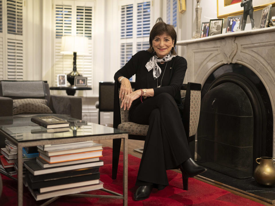 Jeanne Beker poses for a photo with her book in her home in Toronto, on Wednesday, Sept. 25, 2024. (The Canadian Press/Paige Taylor White)