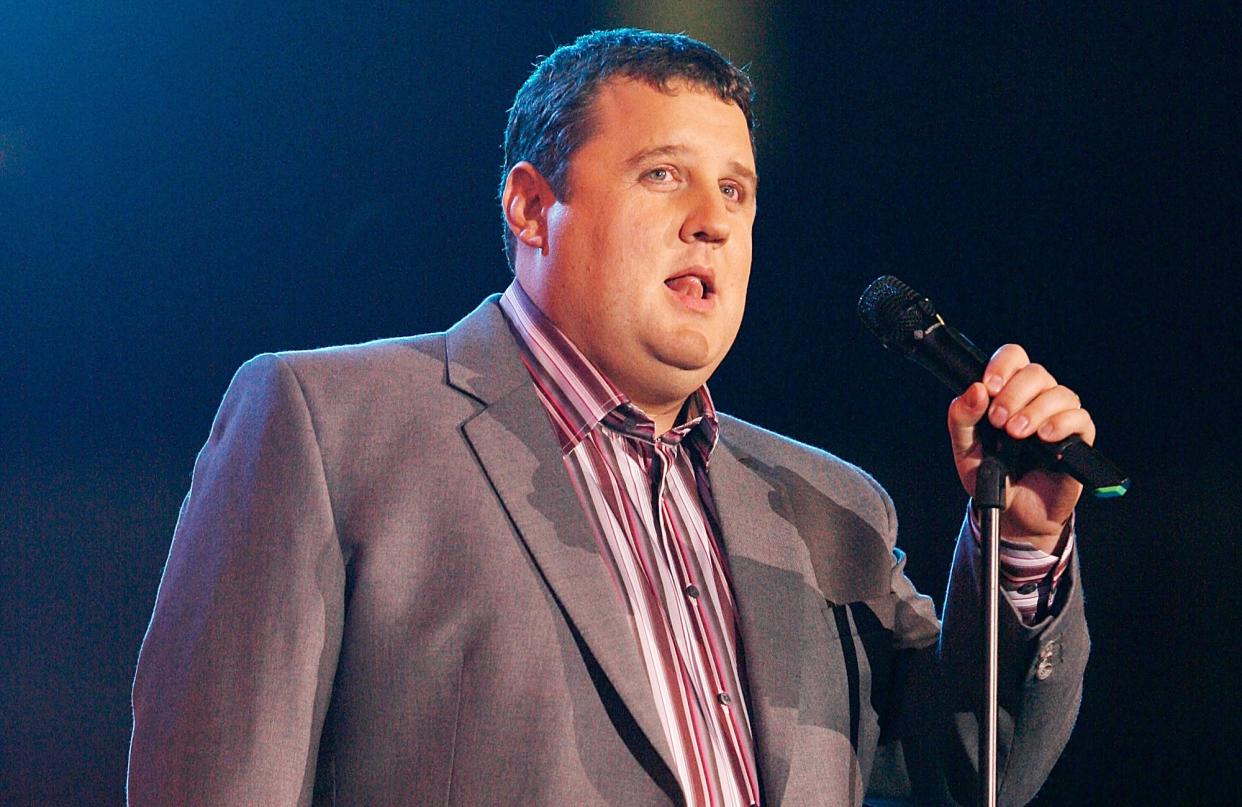 Peter Kay comedian introduces Robbie Williams on stage at the Help for Heroes Concert at Twickenham Stadium in 2010. (PA)