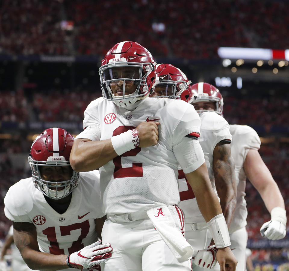 Alabama quarterback Jalen Hurts (2) celebrates his touchdown against Georgia on Saturday. (AP)